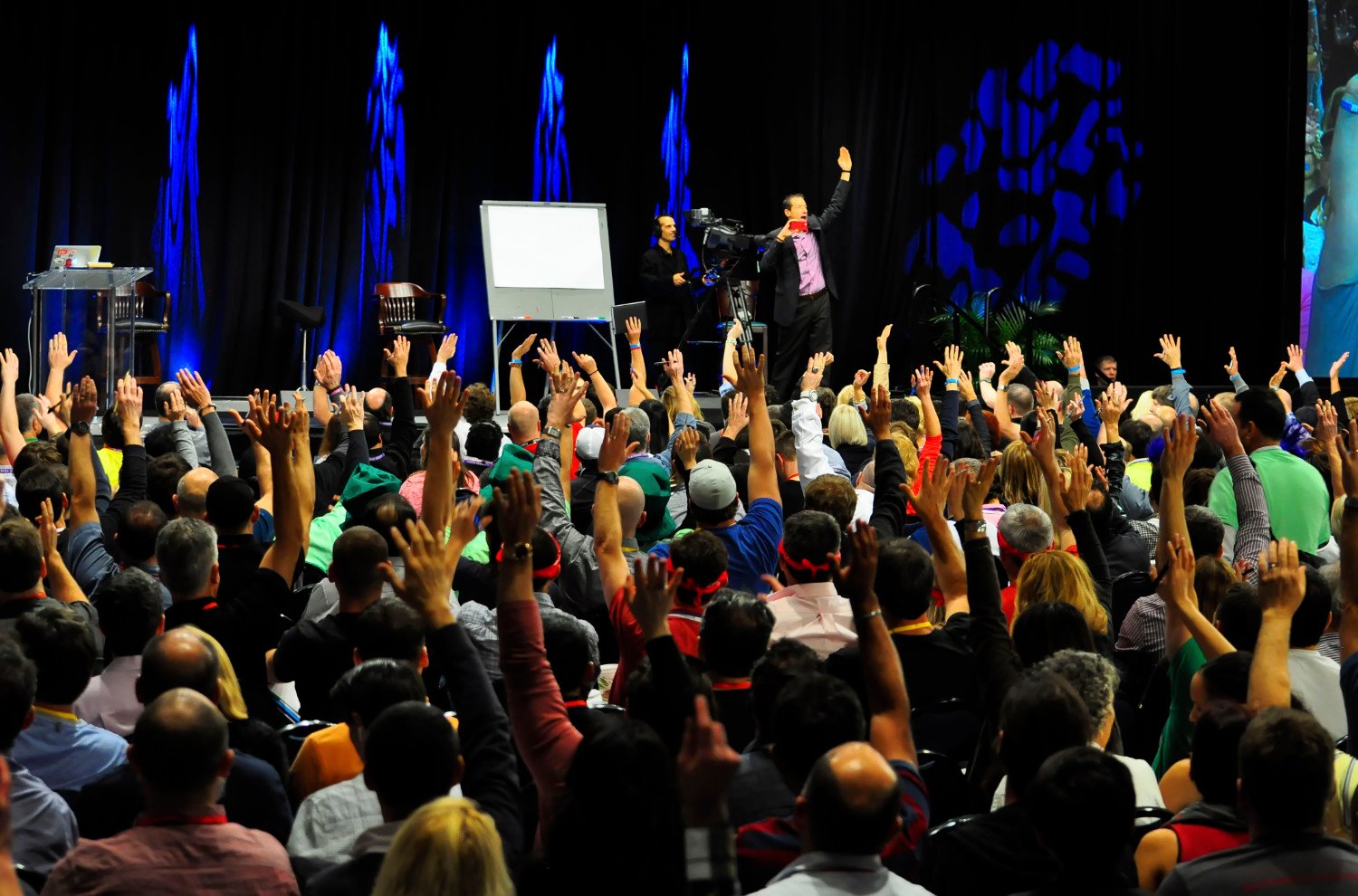 Me presenting at Tony Robbins Business Mastery. Bottom: Me moderating a the “Future Proof Marketing” panel at RECon MENA in Dubai in October 2018, an event organized by the Middle East Council of Shopping Centres.
